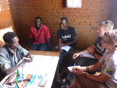 Volunteer Managers Min, Andy and Stan discussing project ideas with Mr Nicodamas Malley (Village executive officer)