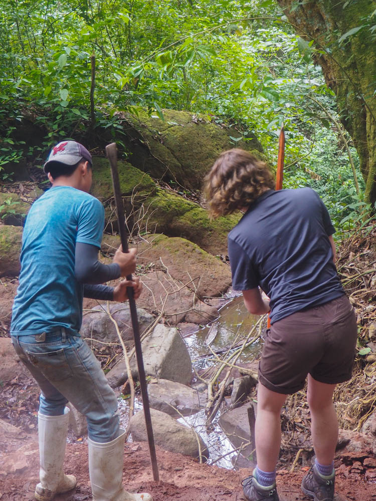 Carving trenches for the water pipes to be laid in.