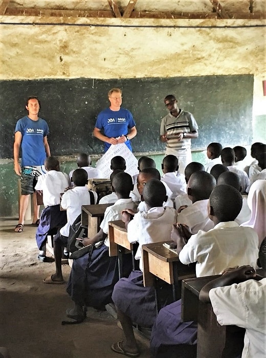JOA volunteers Jonathan and Gavin delivering a SWASH lession to a class of children at Katurkila Primary School