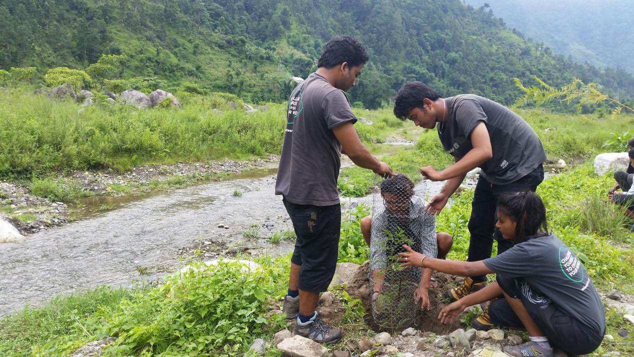 Volunteers Kiran, Prajwal, Sabina and Youth club Treasurer Anjit planting trees