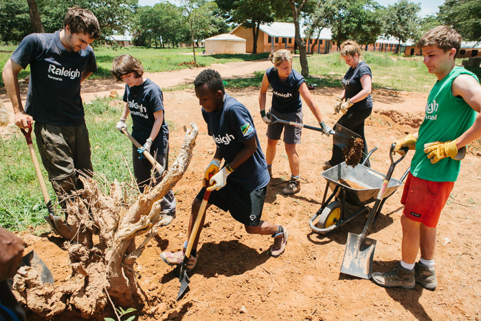 Volunteers digging on a sanitation project in Tanzania