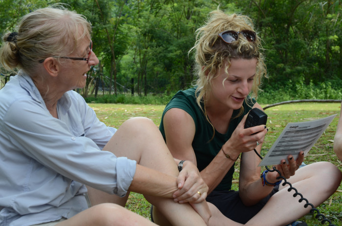 Volunteers in Borneo practice using a radio