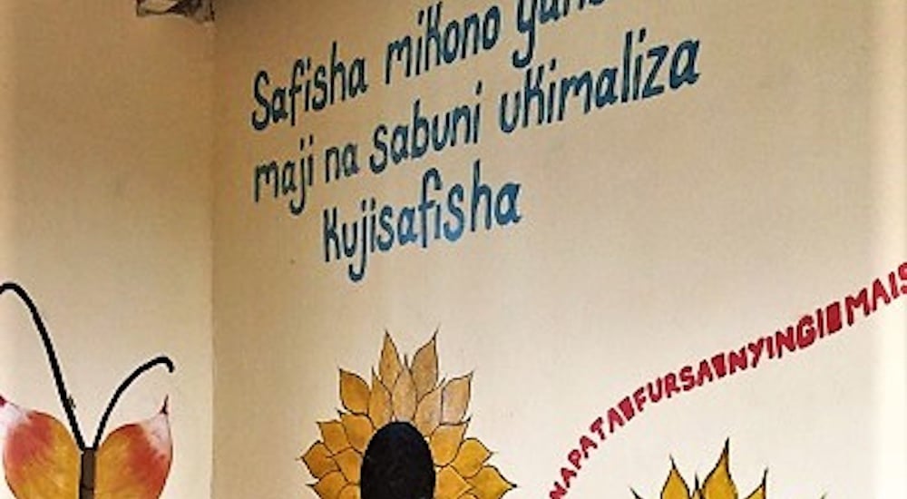 a picture of a wall with a sunflower, butterfly and writings painted on it