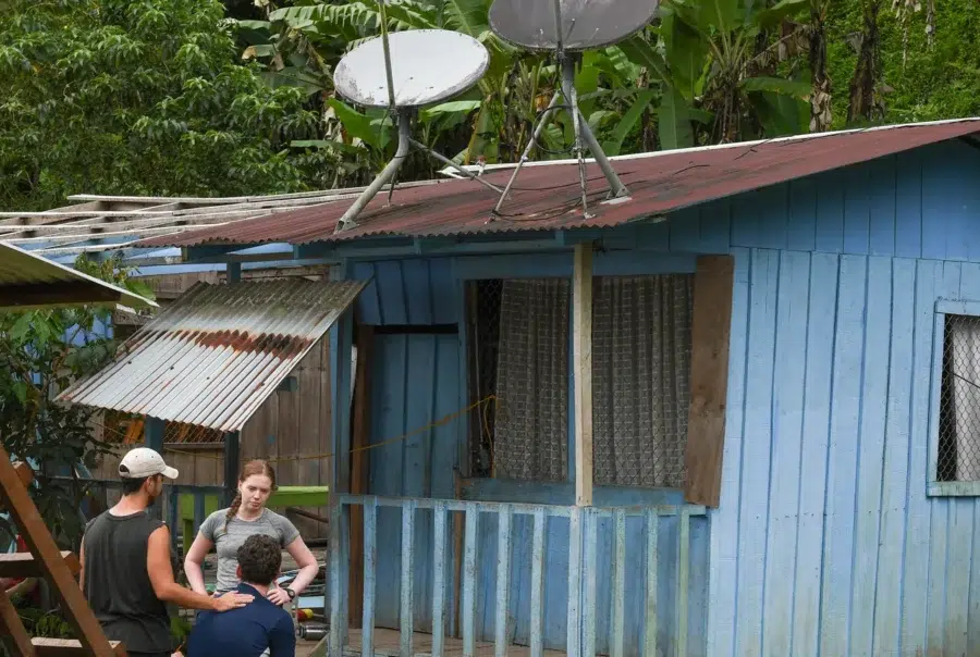 Raleigh Costa Rica_Venturers resting by blue community house